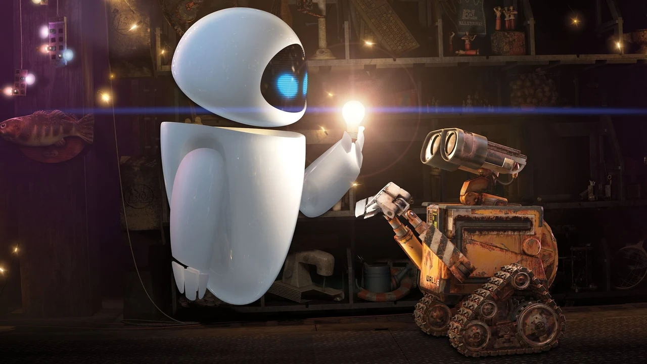 Hai robot nhìn một ngọn sáng nhỏ trong nội thất tối.